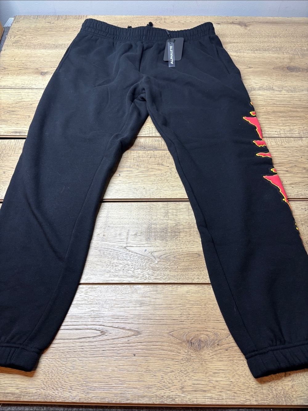 Men’s Alphalete Black Joggers with Red and Yellow Alphaland Detail Size XL NWT
